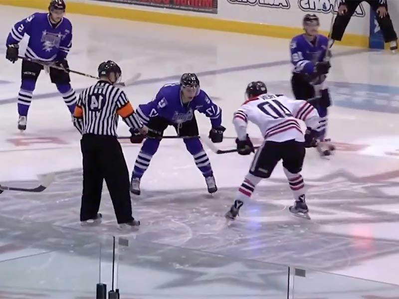 Storm Hockey players getting reading for the puck to drop